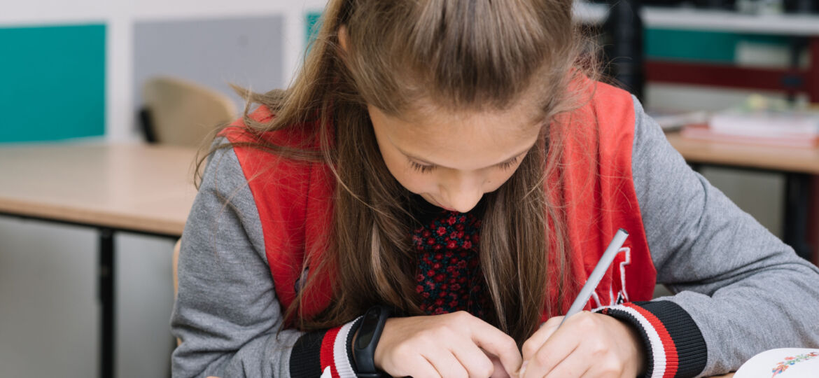 schoolgirl-writing-class